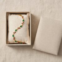 Buy Tulip Bracelet Stainless Steel in Pakistan. Gold vine bracelet with green emerald & red ruby stones. Waterproof, anti-tarnish, hypoallergenic - free size.